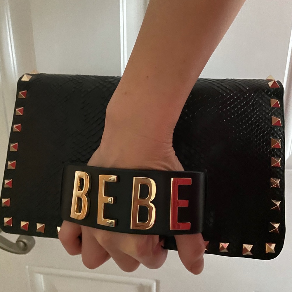 100% leather Bebe crossbody handbag.